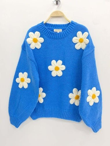 Pull bleu à motifs marguerites de couleurs vertes